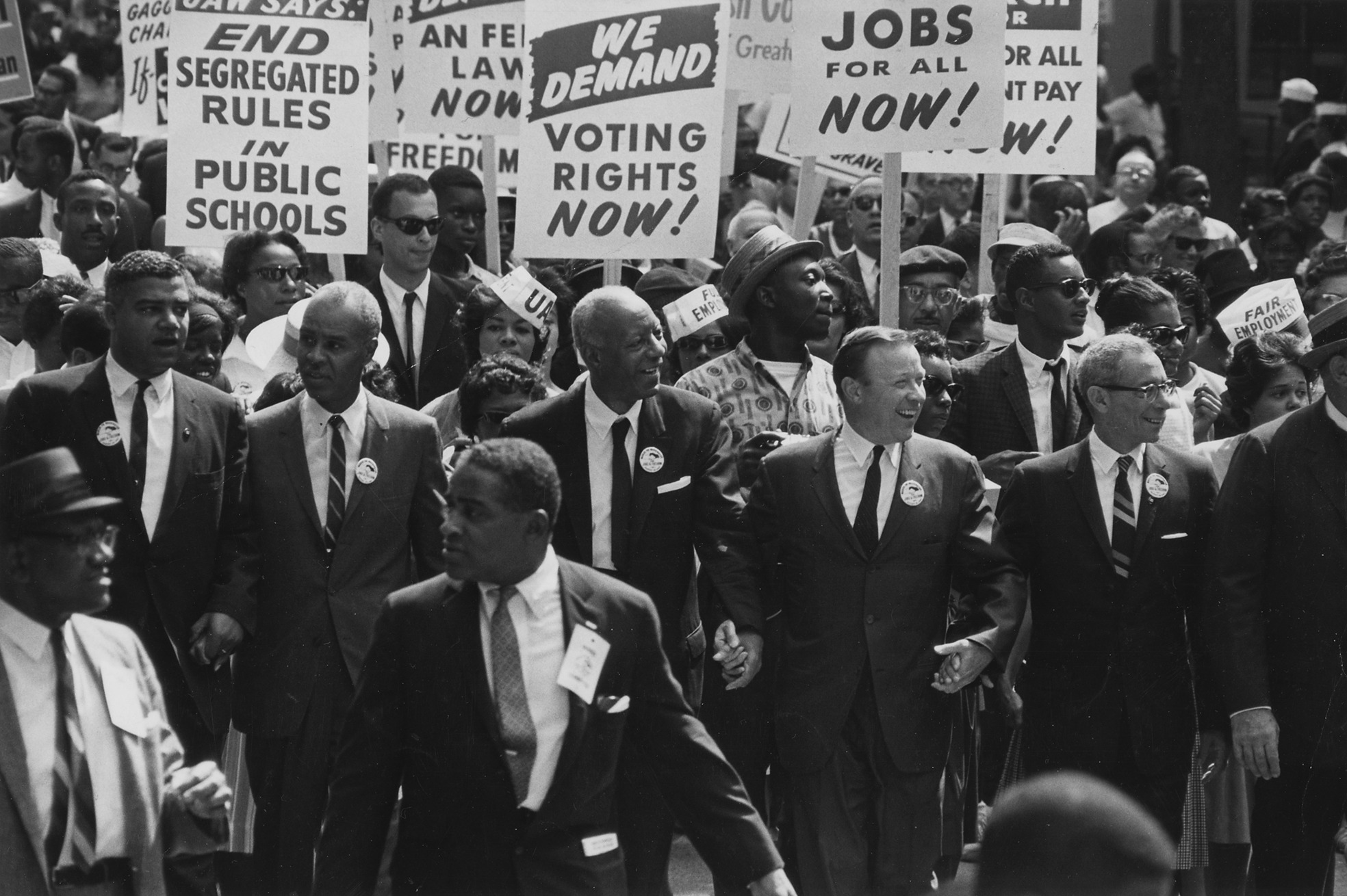 Civil rights leaders and marchers advancing together during the 1963 March on Washington
