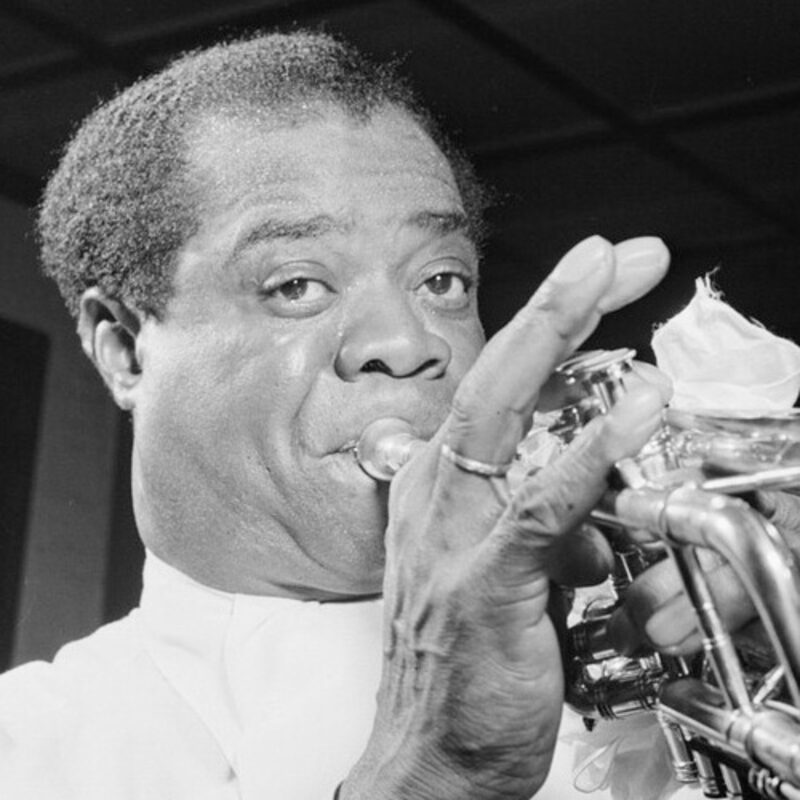 Louis Armstrong performing on trumpet